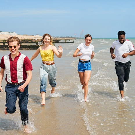 Students running on Bognor Beach