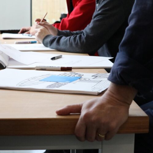 Close up of students designs on desk