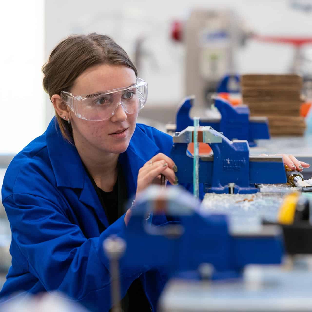 female engineering student using equipment