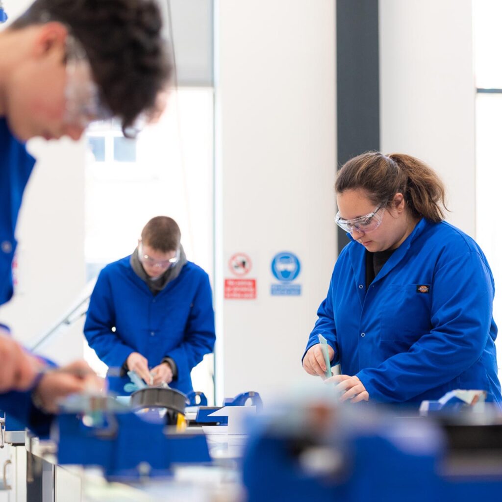 engineering students using equipment
