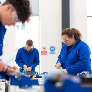engineering students using equipment