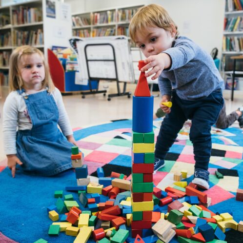 children playing with building blocks together