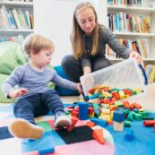early years student working with young child and building blocks