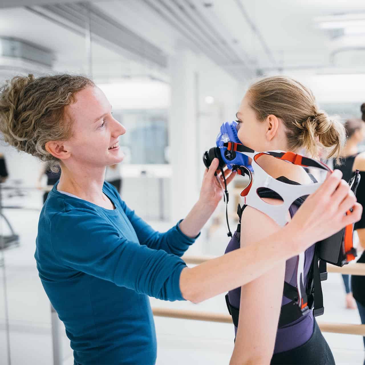 dance science students working with respiratory equipment