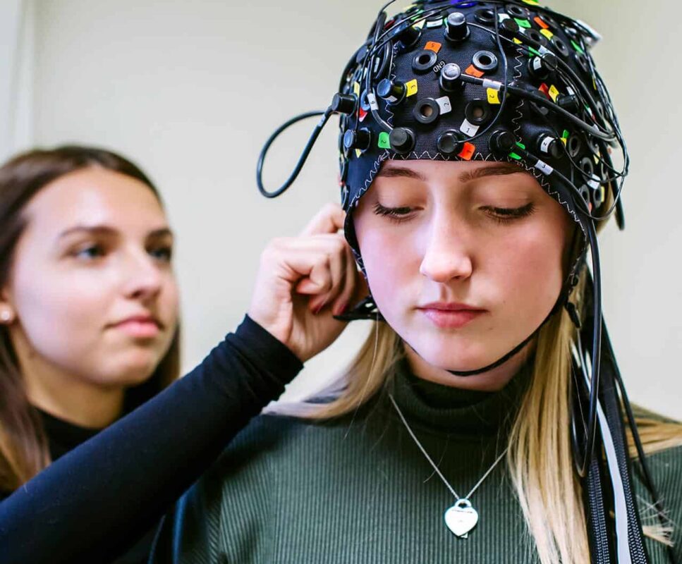 Students using psychology equipment