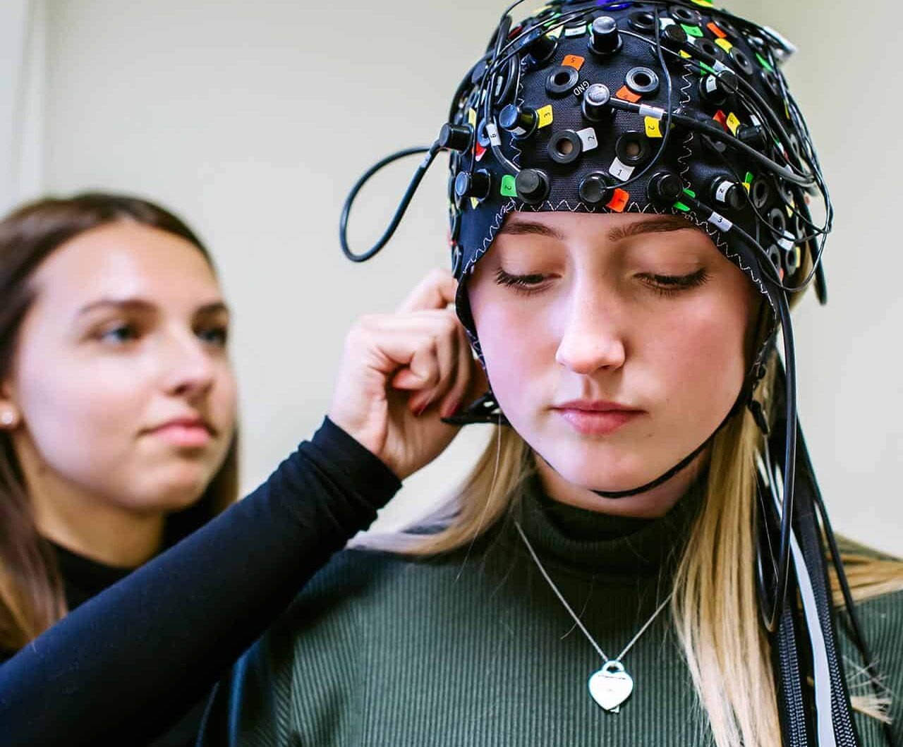 Students using psychology equipment