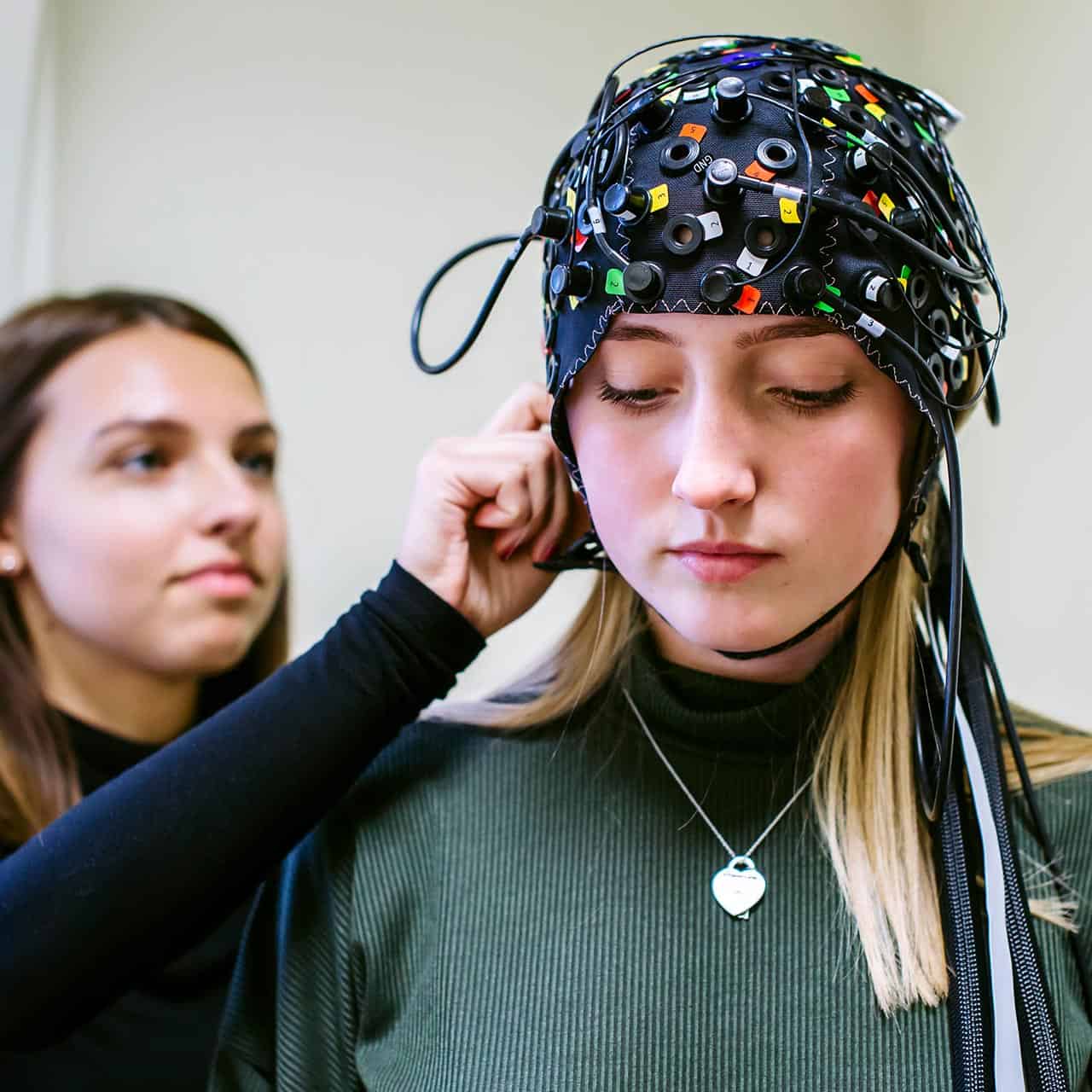 Students using psychology equipment