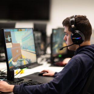 Esports student playing a game in a computer room