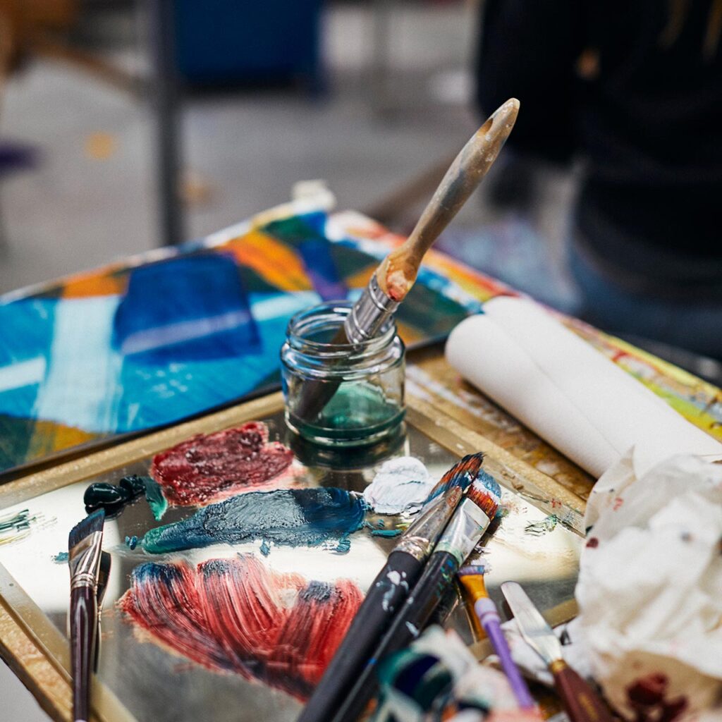 Close up of paint brushes and paint