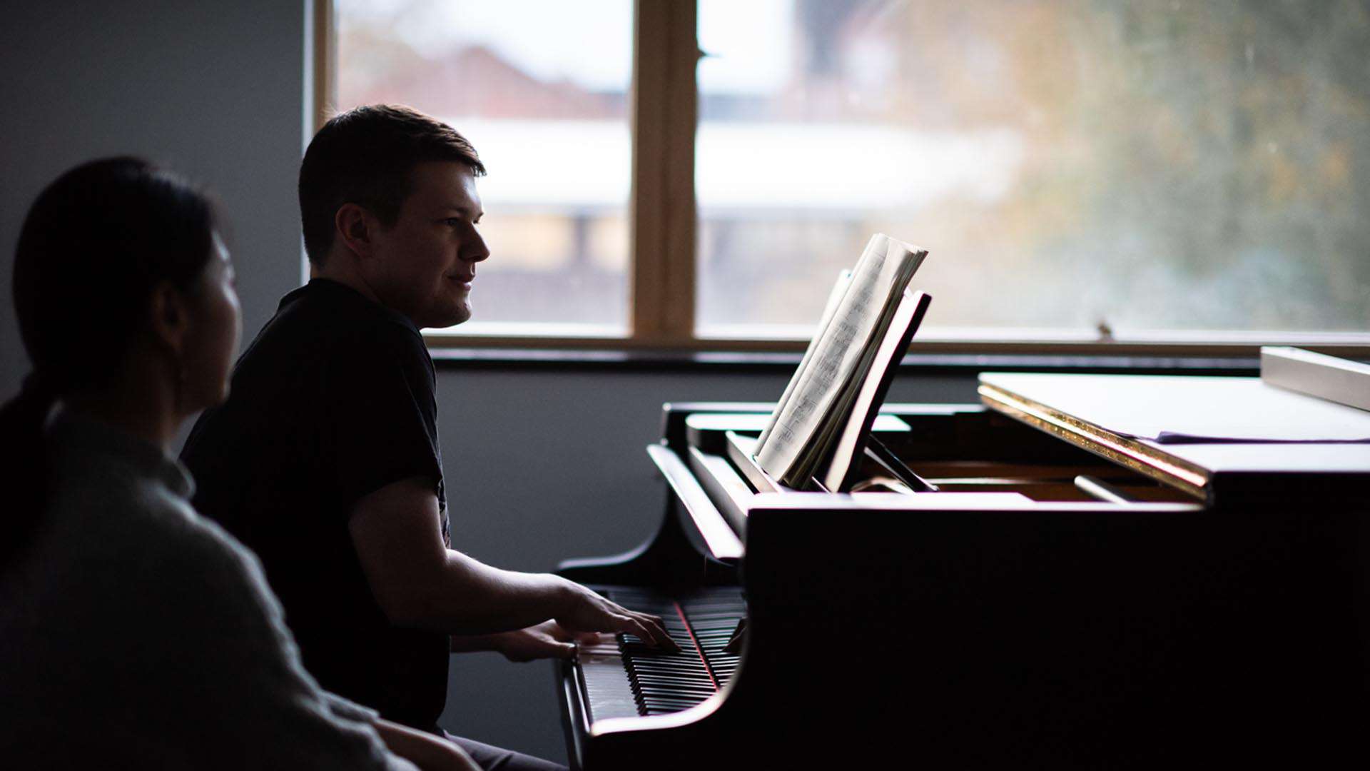 music student playing piano