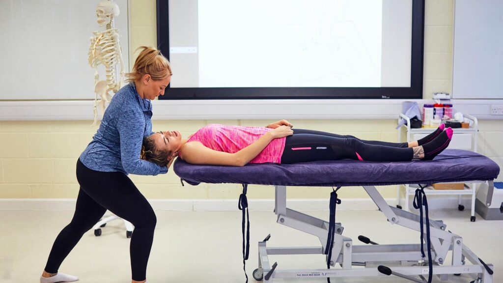 Sports therapy students working in the injury clinic