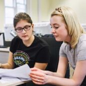 Two law students reading through some paperwork