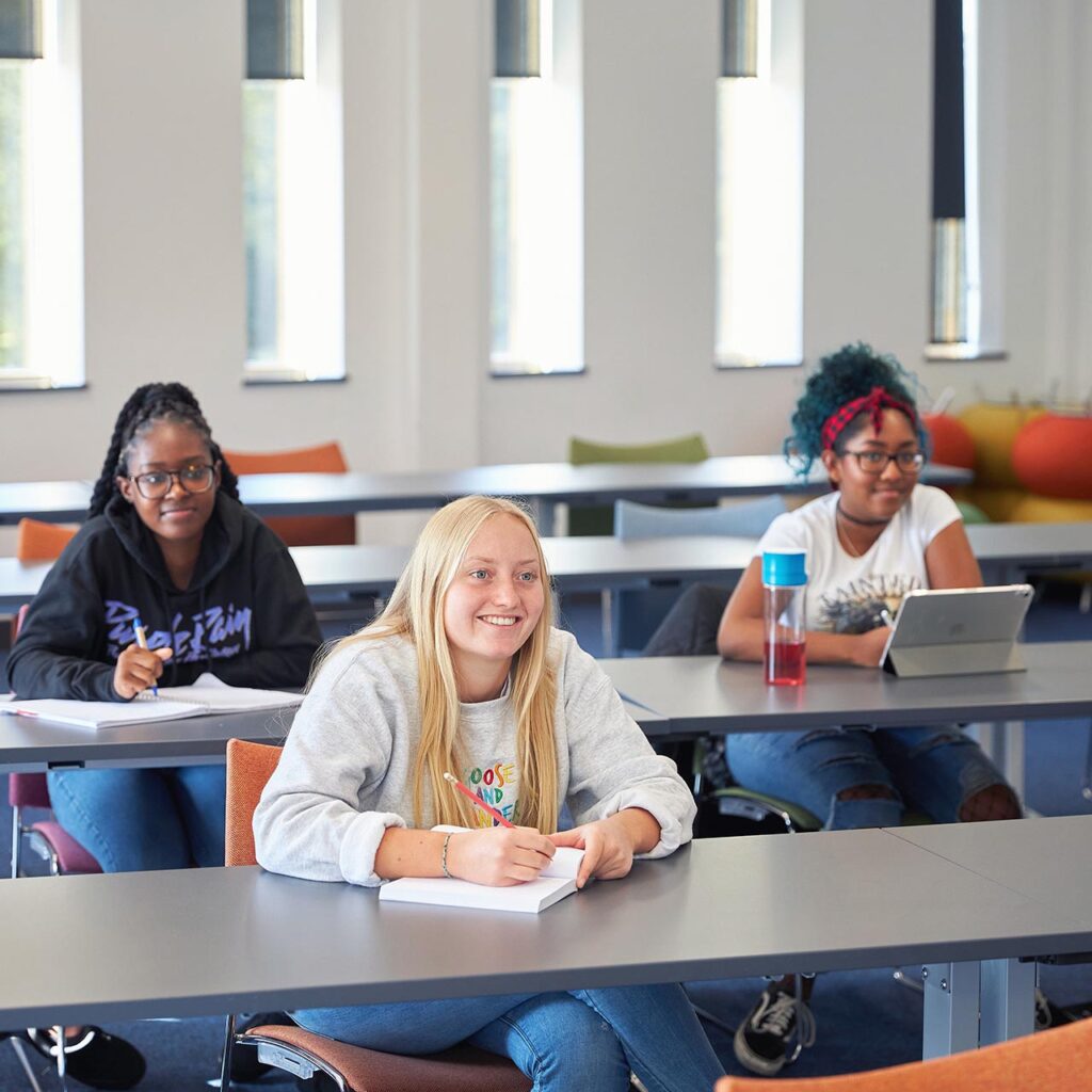 students smiling in seminar