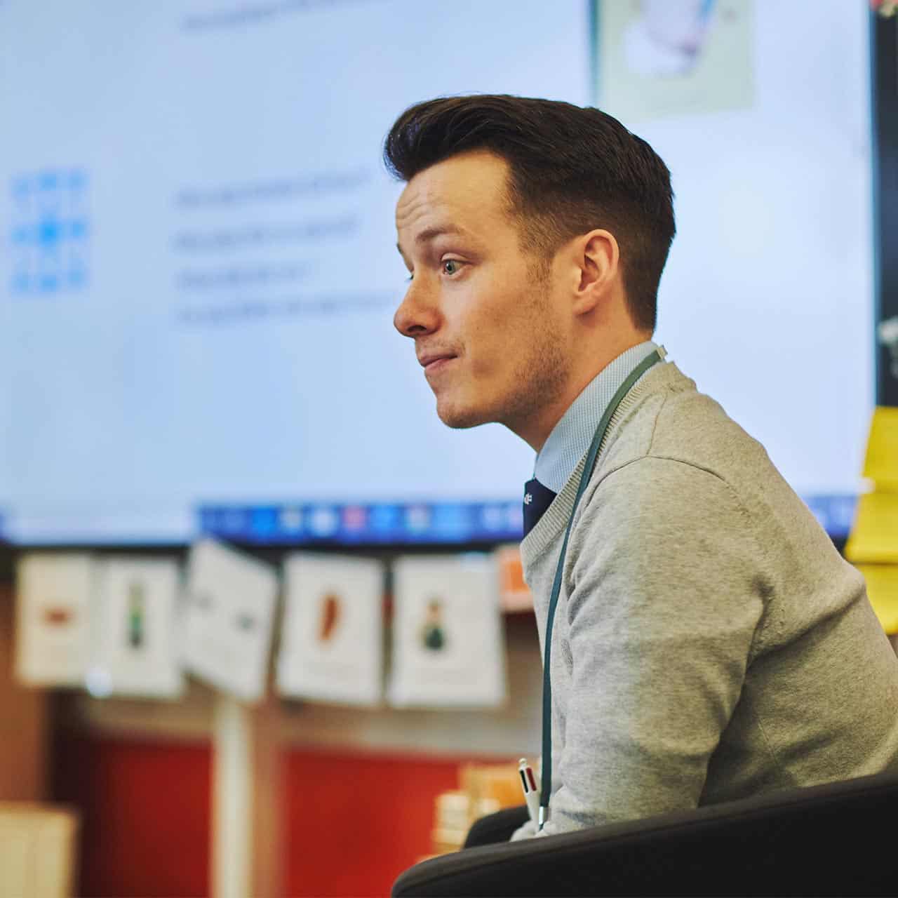 teacher teaching his class