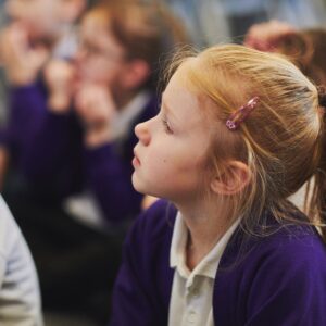 Primary school pupil listening carefully