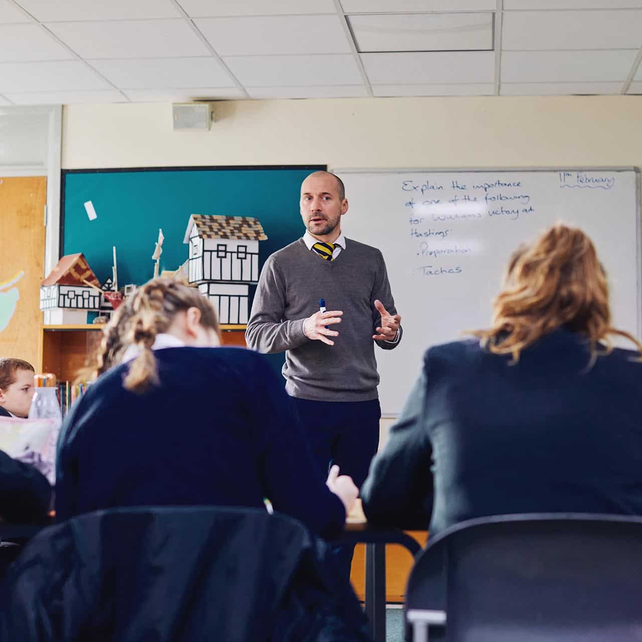 student teacher teaching a secondary school class History