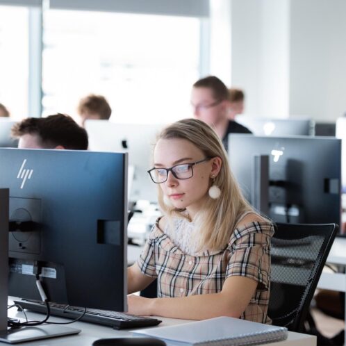 female student working on a computer