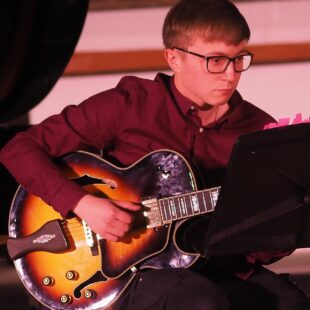 Jazz student performing with guitar