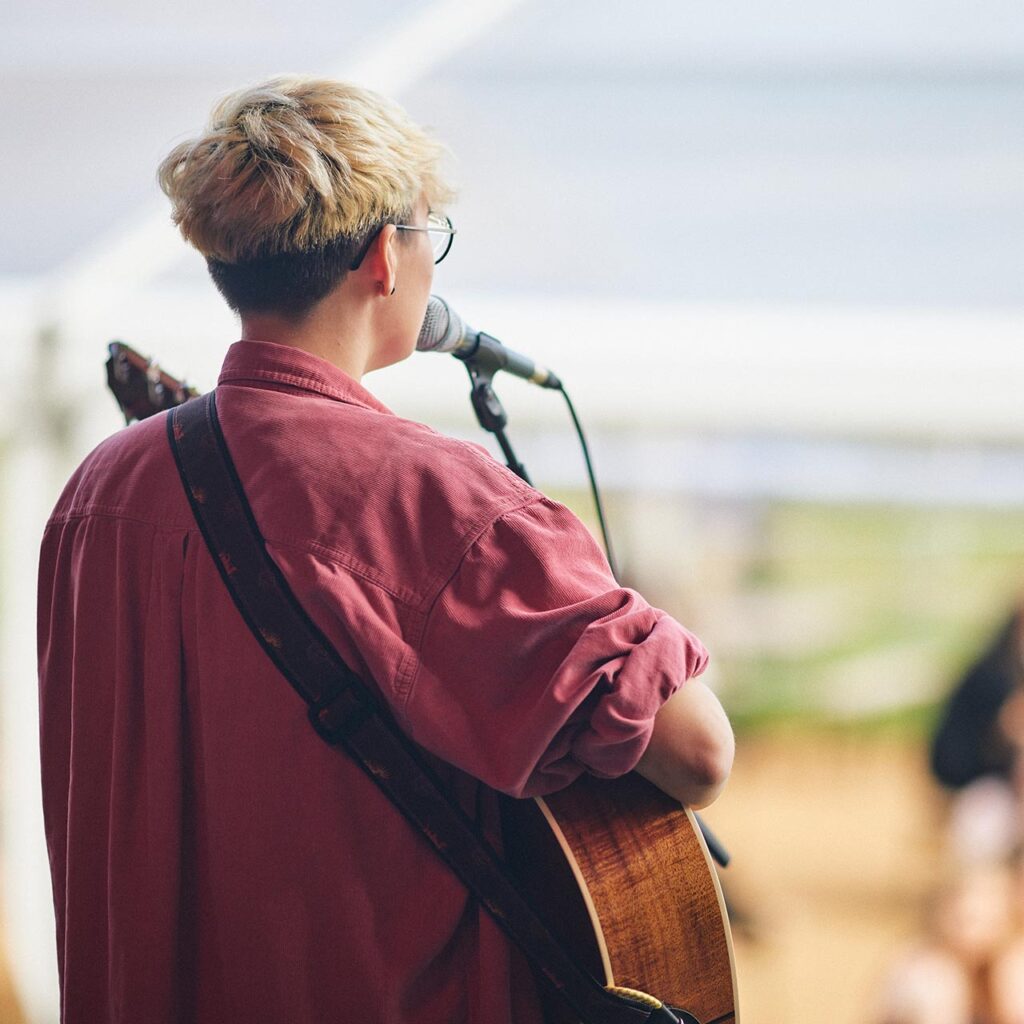 student performing on stage