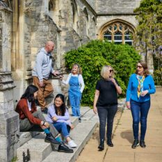 group of students walking outside Cloisters