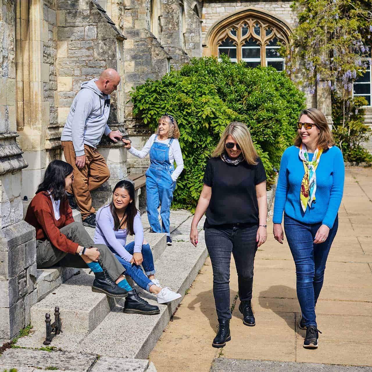 21+ Students BOC 1280 X 1280 29 group of students walking outside Cloisters