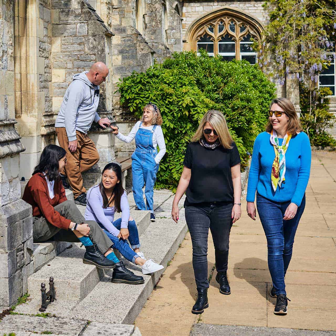 group of students walking outside Cloisters