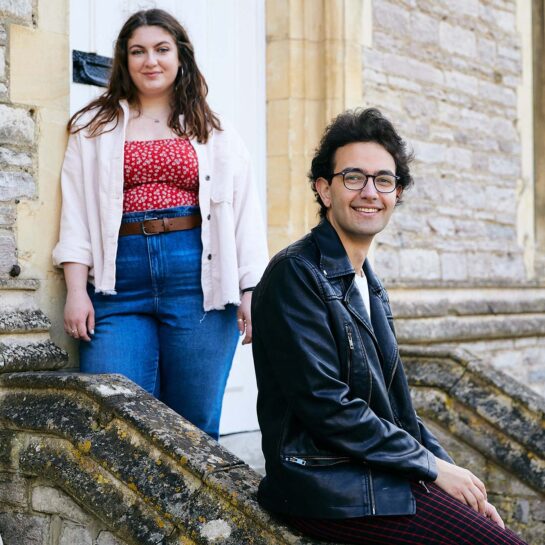 Students sitting on stone steps