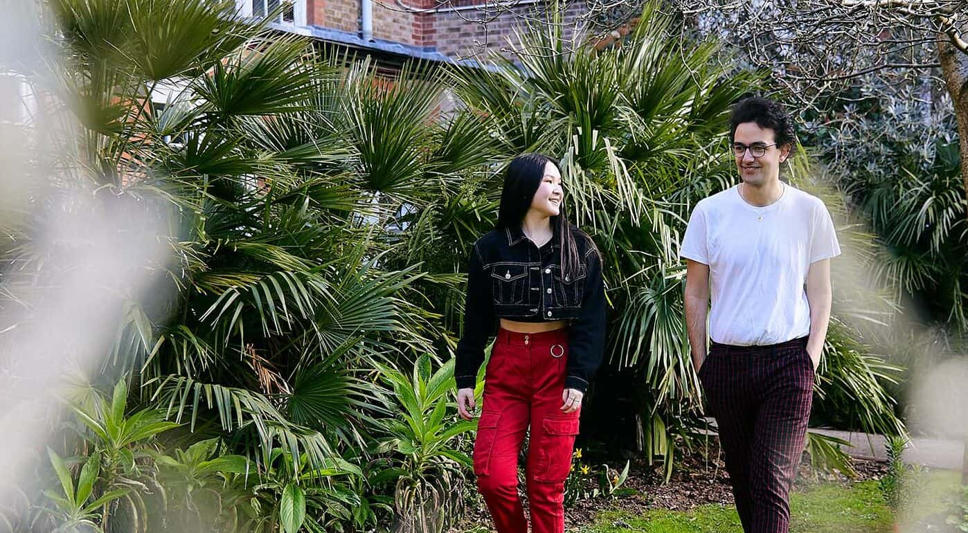 two students walking on Bishop Otter campus