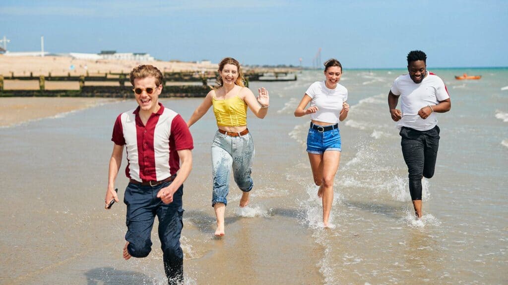 21 Students Bognor Beach 1920 X 1080 4 4 students running and laughing on Bognor Regis beach