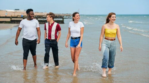 students walking along bognor beach