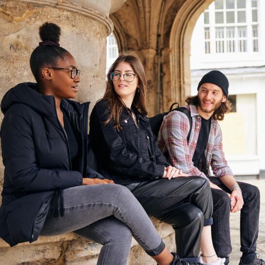 Students sat at Chichester Cross