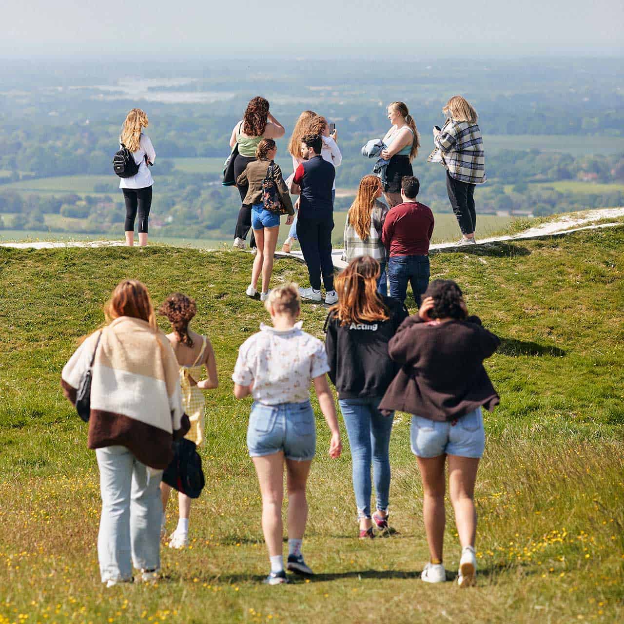 Students walking on field in goodwood Trundle