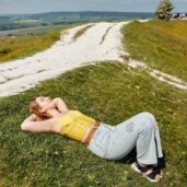 Student Laying on Field in Goodwood Trundle