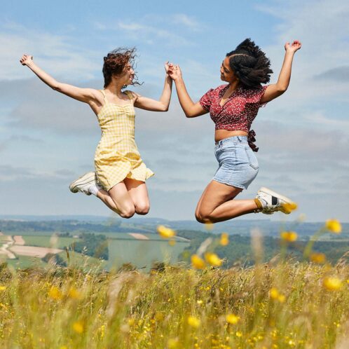 Students Jumping in field at goodwood Trundle