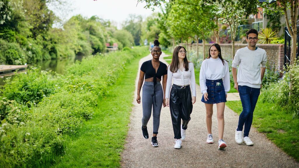 21 Students Chichester Park 1920 X 1080 12 Students walking through Chichester Park