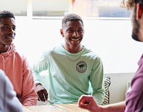 student laughing with friends