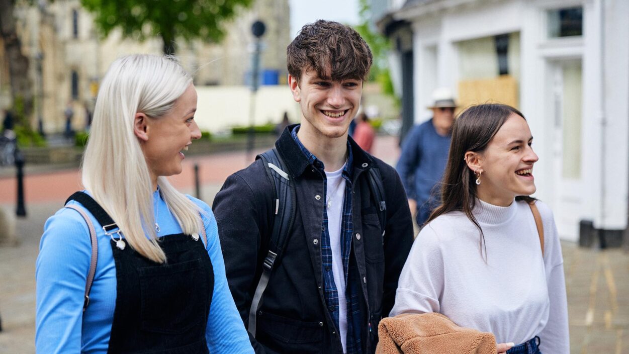 students smiling in town centre