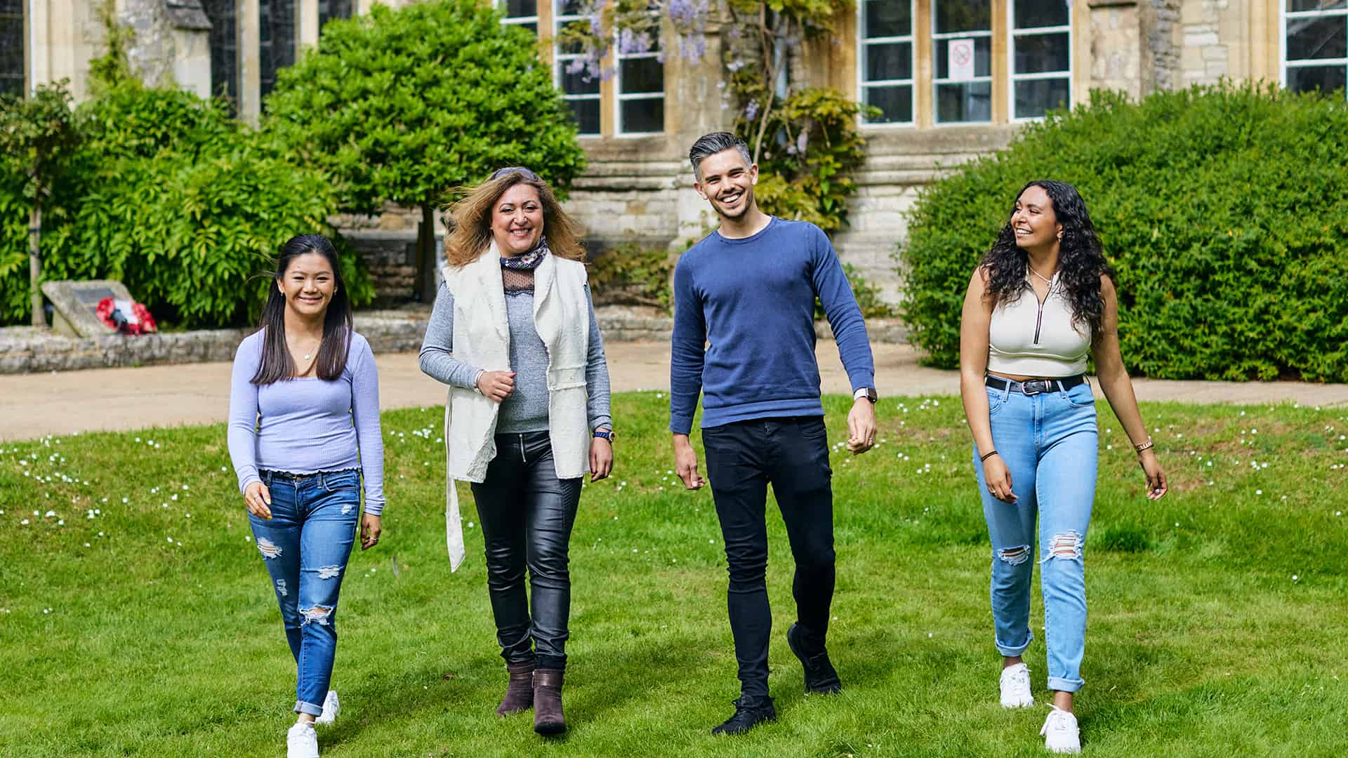 students walking on Cloisters lawn