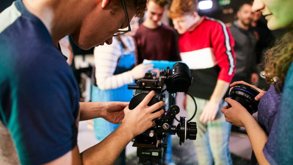 Students using indutry standard equipment to shoot on location