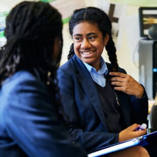 two school girls chatting