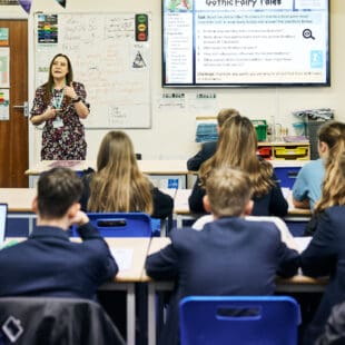 children being taught in a classroom