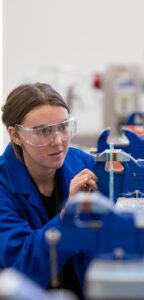 female engineering student using equipment