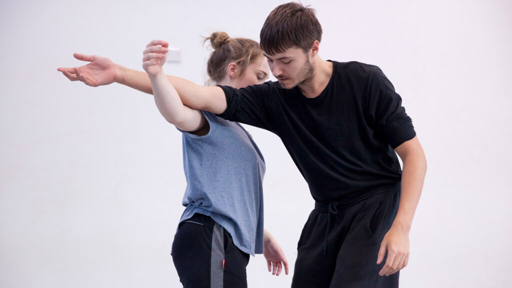 Dance students rehearsing in white room