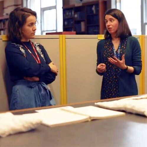 Placements A history student in discussion with a staff member whilst on a work placement