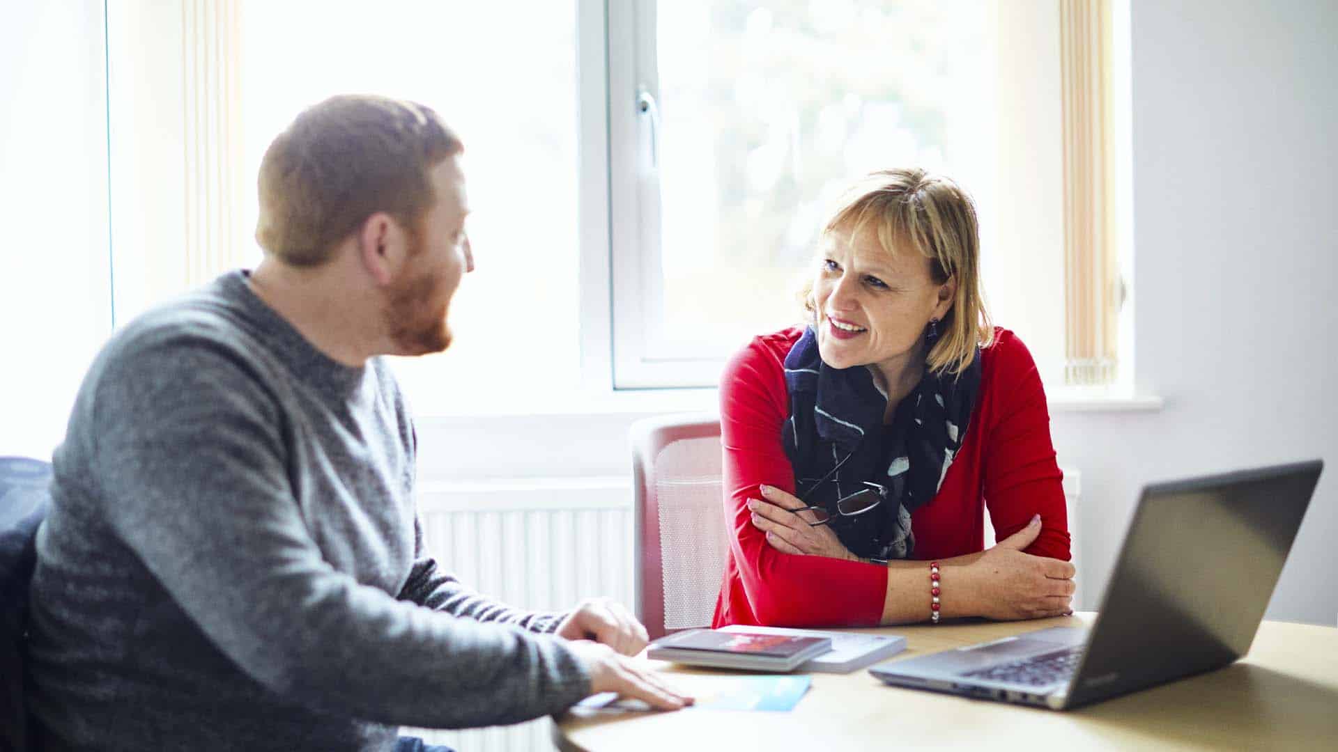 Two people engaged in professional-level conversation