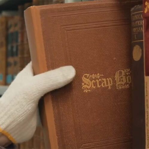 Pulling Out Book Pulling out book with glove on