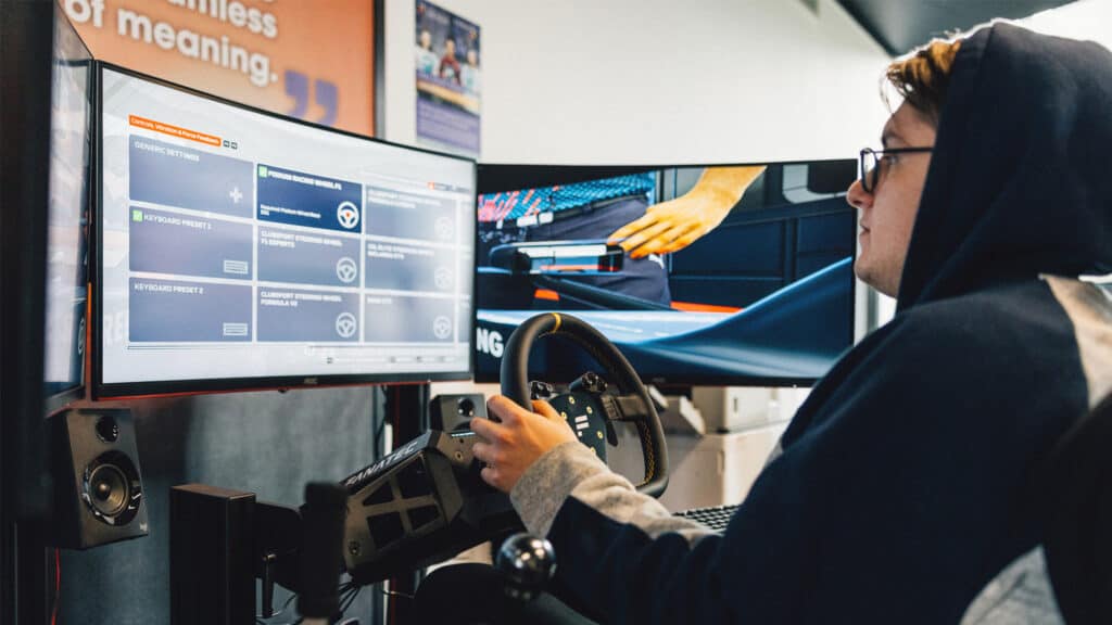 Person playing a racing simulation game as part of the Esports Degree Course at the University of Chichester.