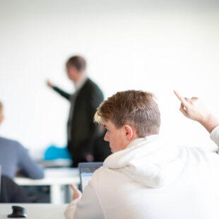 Student with hand raised