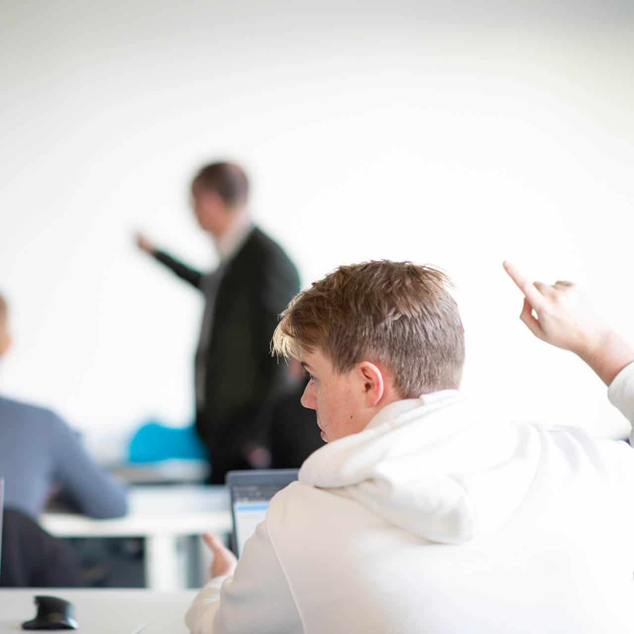 Student with hand raised