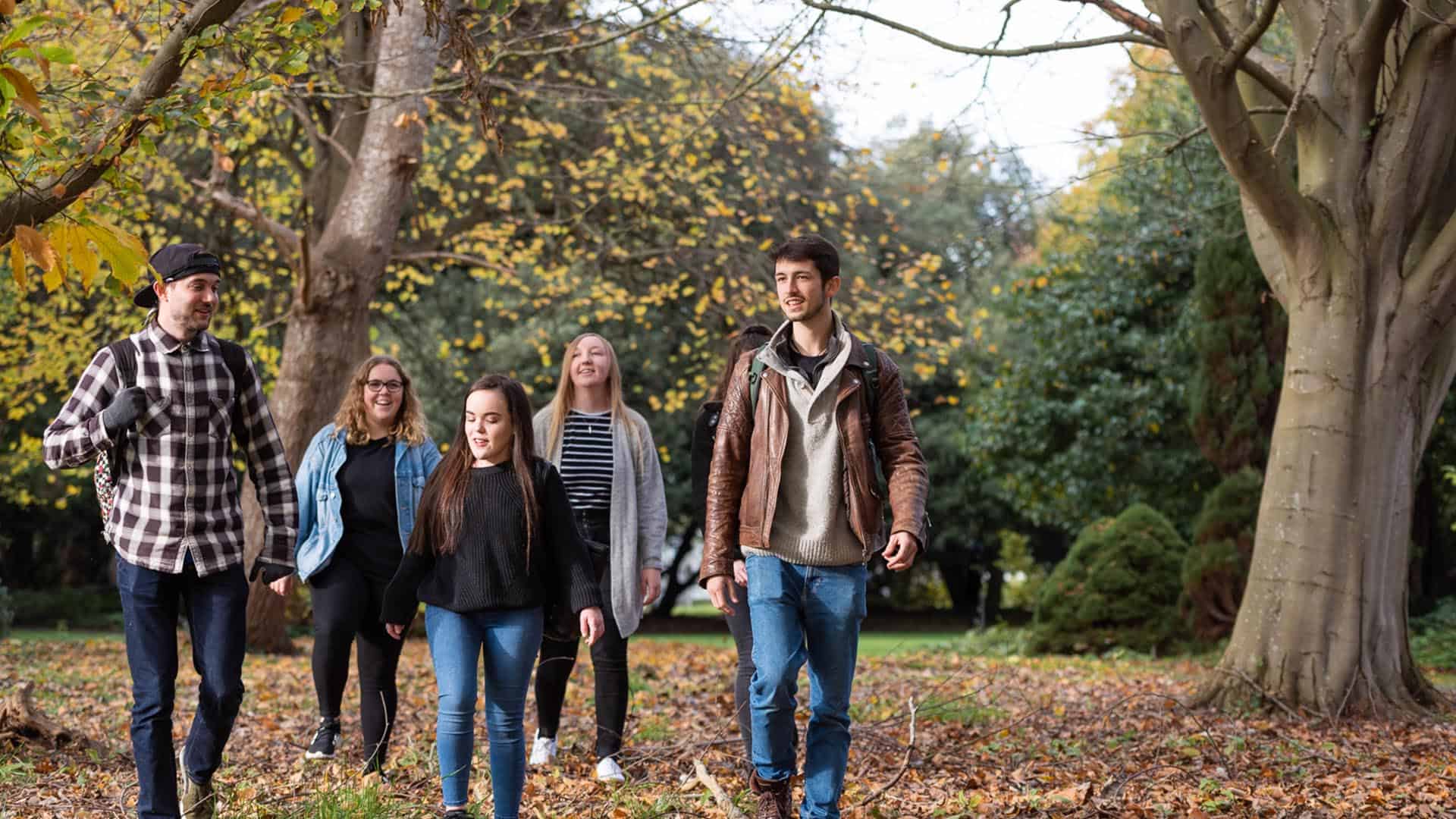 group of students walking through campus